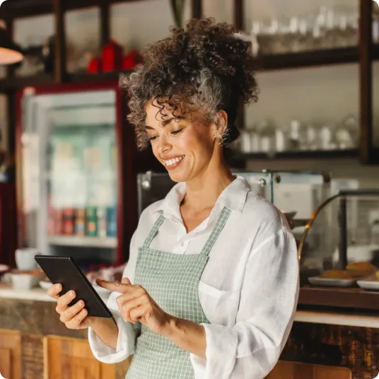 Restaurant owner using tablet device in kitchen