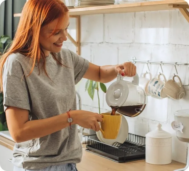 Woman pouring coffee in kitchen with smart home voice command overlay