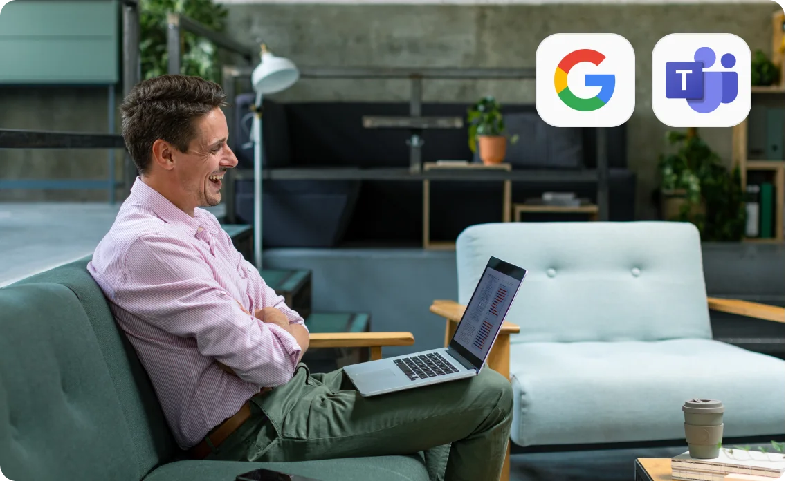 Smiling man on a couch using a laptop, with Google and Microsoft Teams logos above.