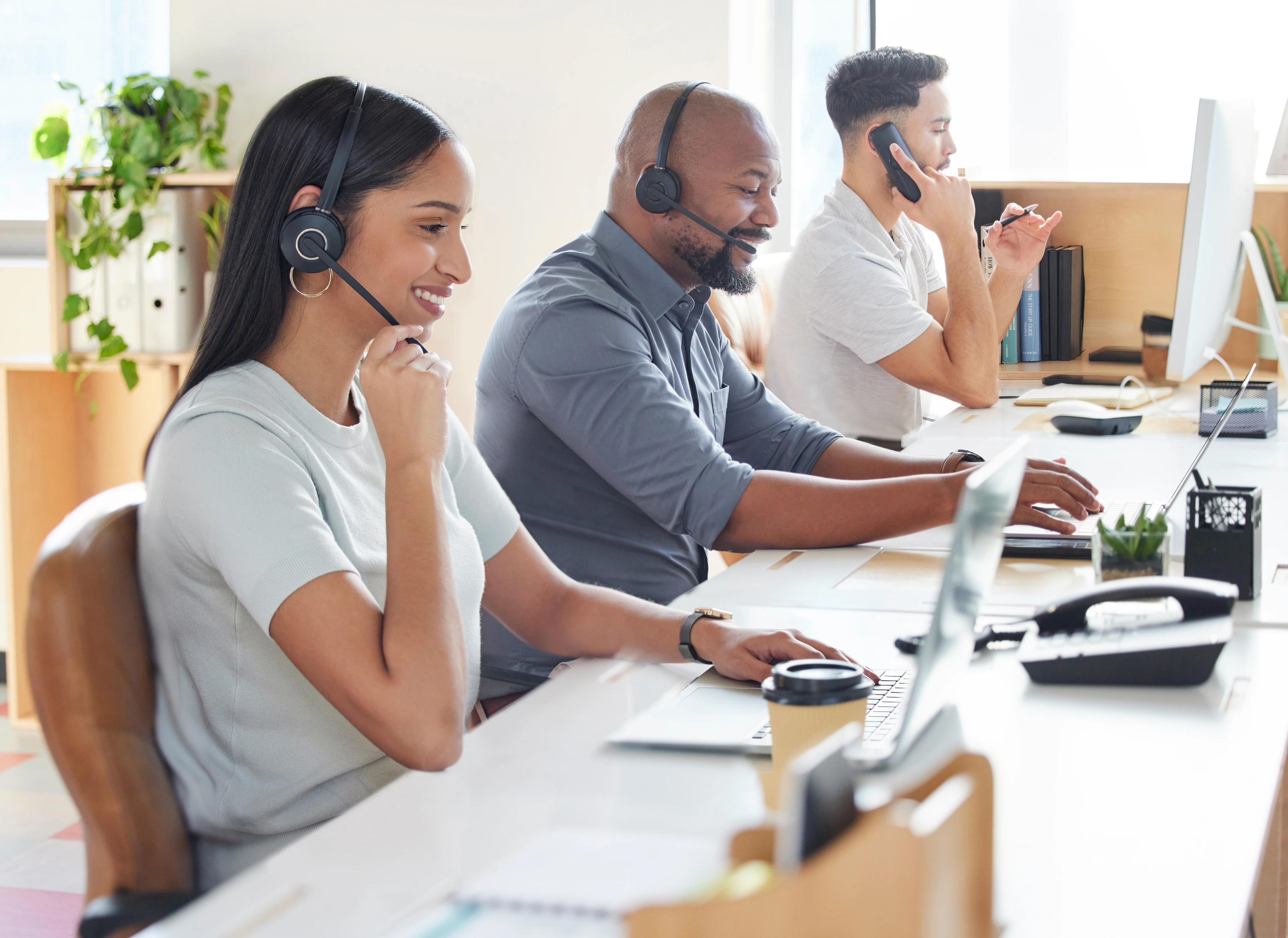 3 call centre workers giving dedicated customer support
