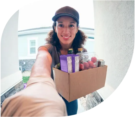 A doorbell security camera view and a woman looking at it on her phone. 