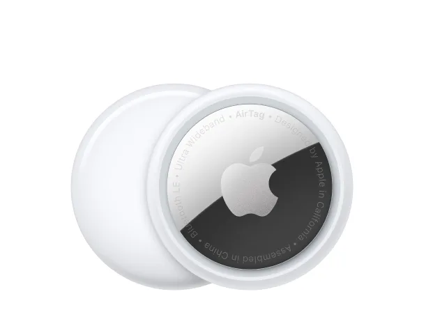 Two sleek, circular AirTag, white on the back and shiny on the front.