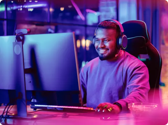 A man using a gaming computer.