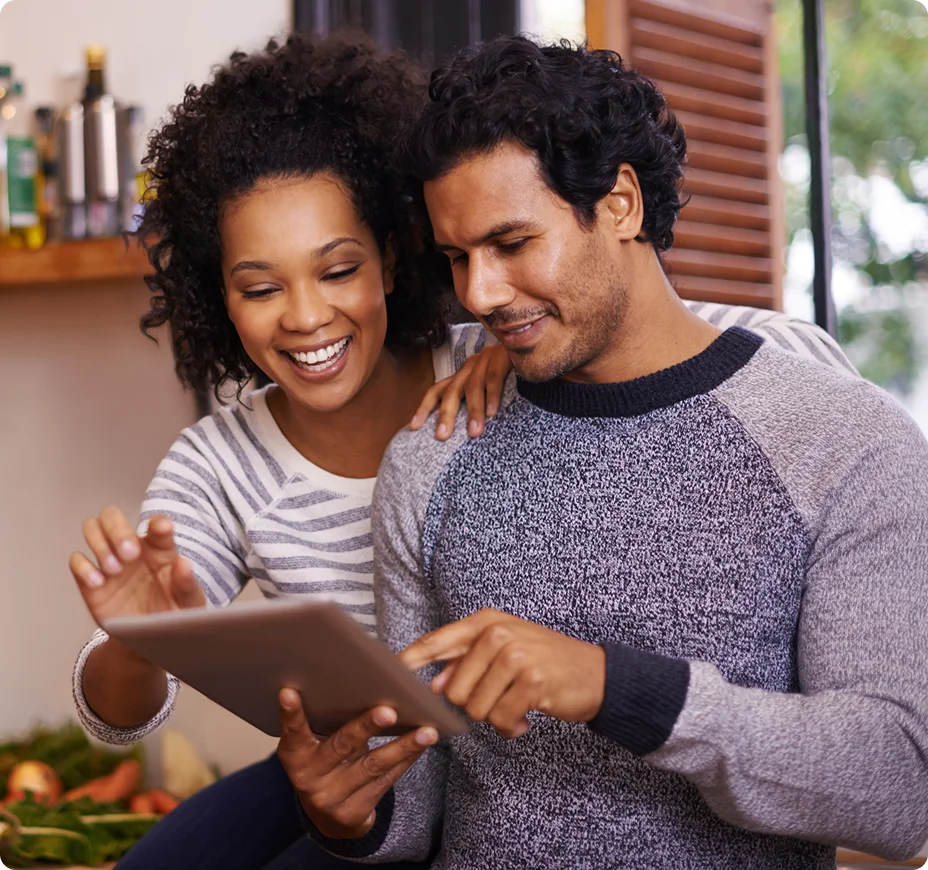 Couple using tablet to access customer service portal.