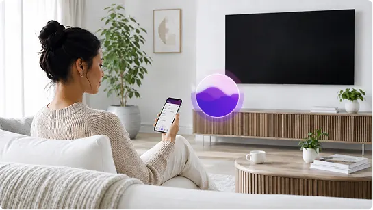 A woman using her mobile in front of a TV with Al-powered smart home assistant on the background.
