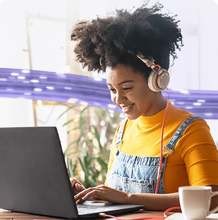 A woman working on a laptop.