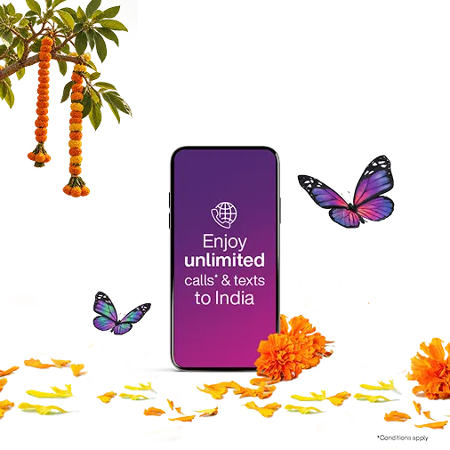 Scattered marigold petals, butterflies, and other decorations surround a smartphone with text that reads "Enjoy unlimited calls & texts to India".