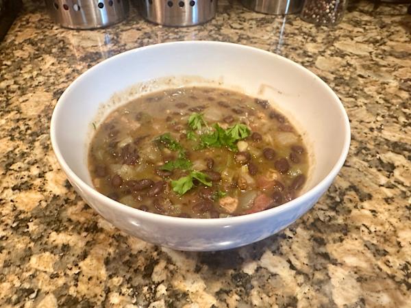 A bowl of Cuban black bean soup.