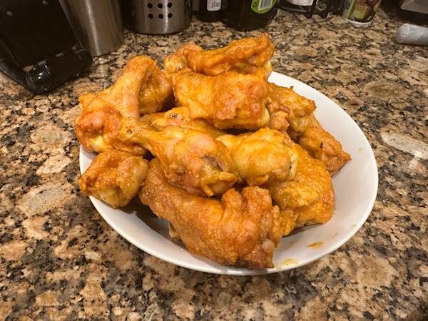 A plate of buffalo wings.