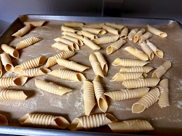 A tray of fresh garganelli pasta.