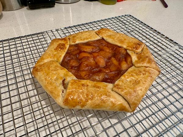 An apricot galette on a cooling rack.