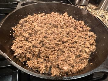 A skillet full of seasoned taco meat.