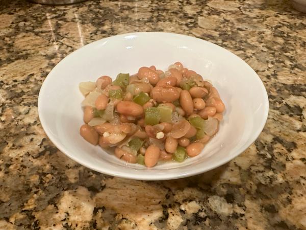 A bowl of pinto beans.