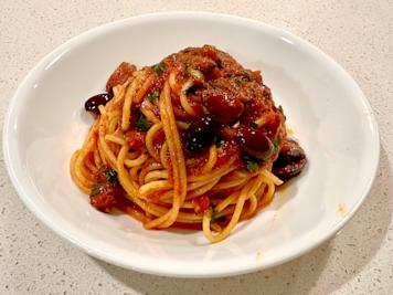 A plate of pasta putanesca.