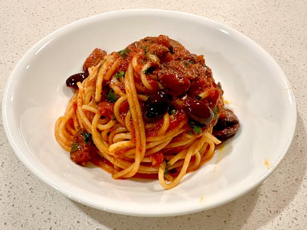 A plate of pasta putanesca.