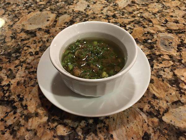 Sliced pork tenderloin steaks with ginger scallion relish.