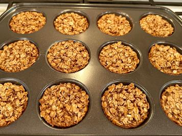 A muffin tray filled with baked oatmeal.