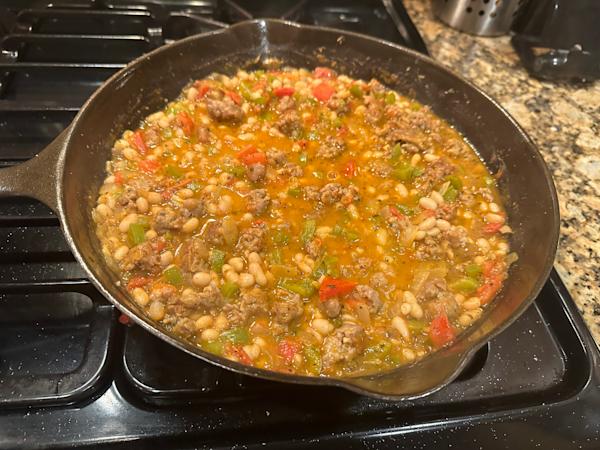 Italian sausage with peppers, onions, and white beans.