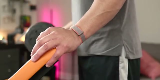 Close-up%20of%20the%20tiny%20Fitbit%20Air%20tracker%2C%20highlighting%20its%20compact%20size%20and%20sensors%20on%20the%20back.