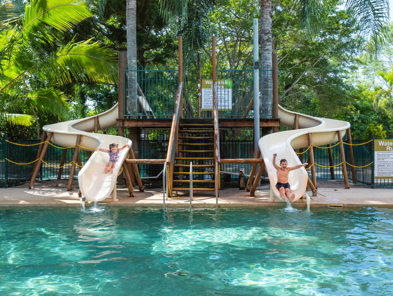 Kids on waterslide at Cape Hillsborough Nature Tourist Park, Mackay.