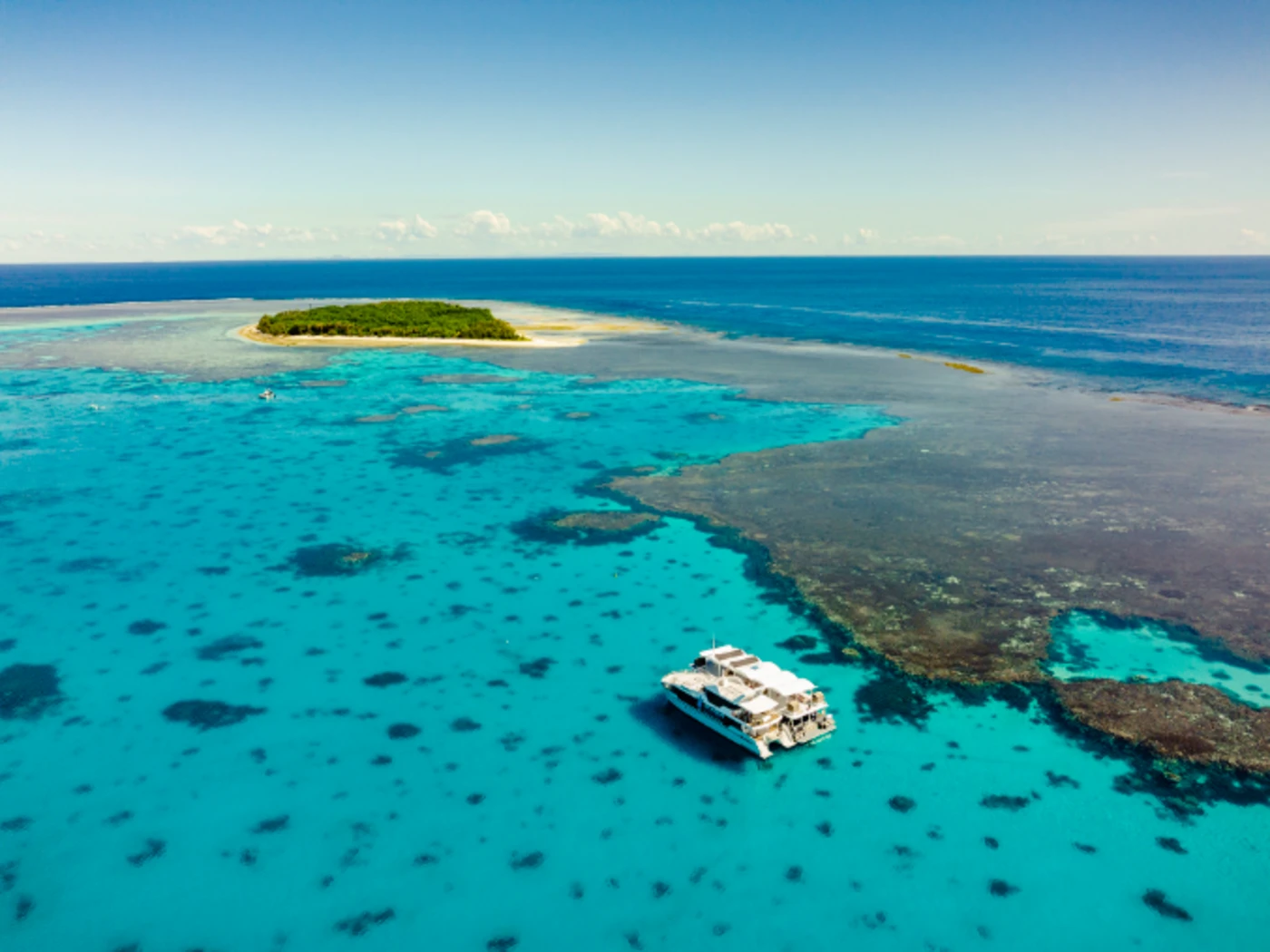 Aerial view of two boats in crystal clear waters off Lady Musgrave Island