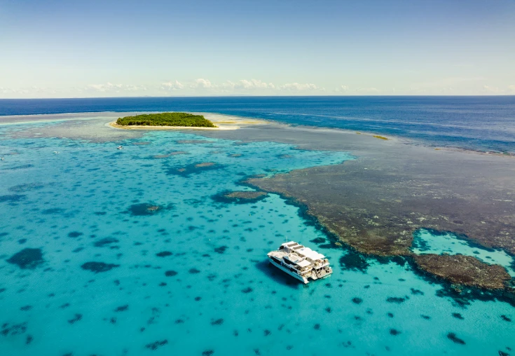 Aerial view of two boats in crystal clear waters off Lady Musgrave Island