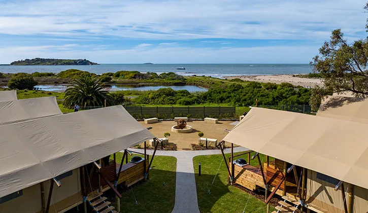 Safari tents with glimpse to the ocean