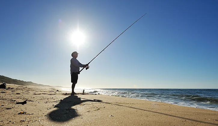 Man fishing on the beach