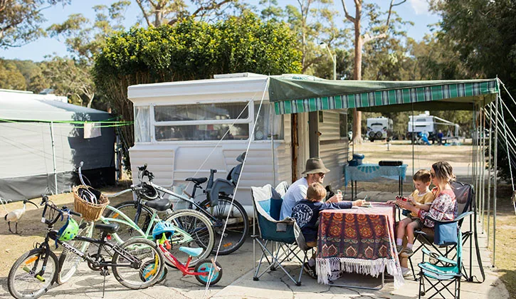 Family set up on caravan site at Ocean Beach 