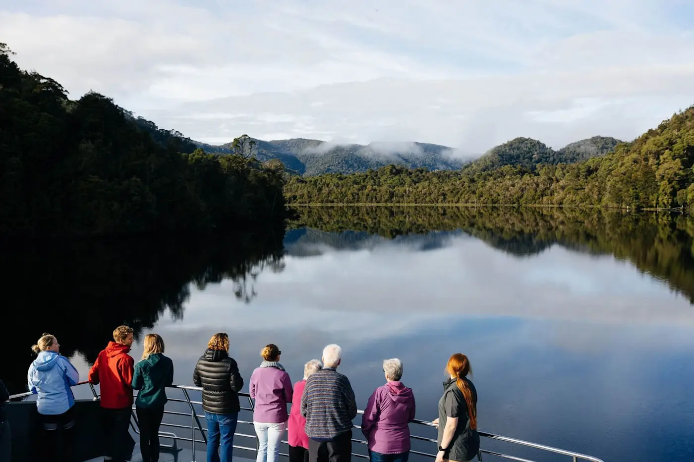 People watching the River from the ship near Strahan Village