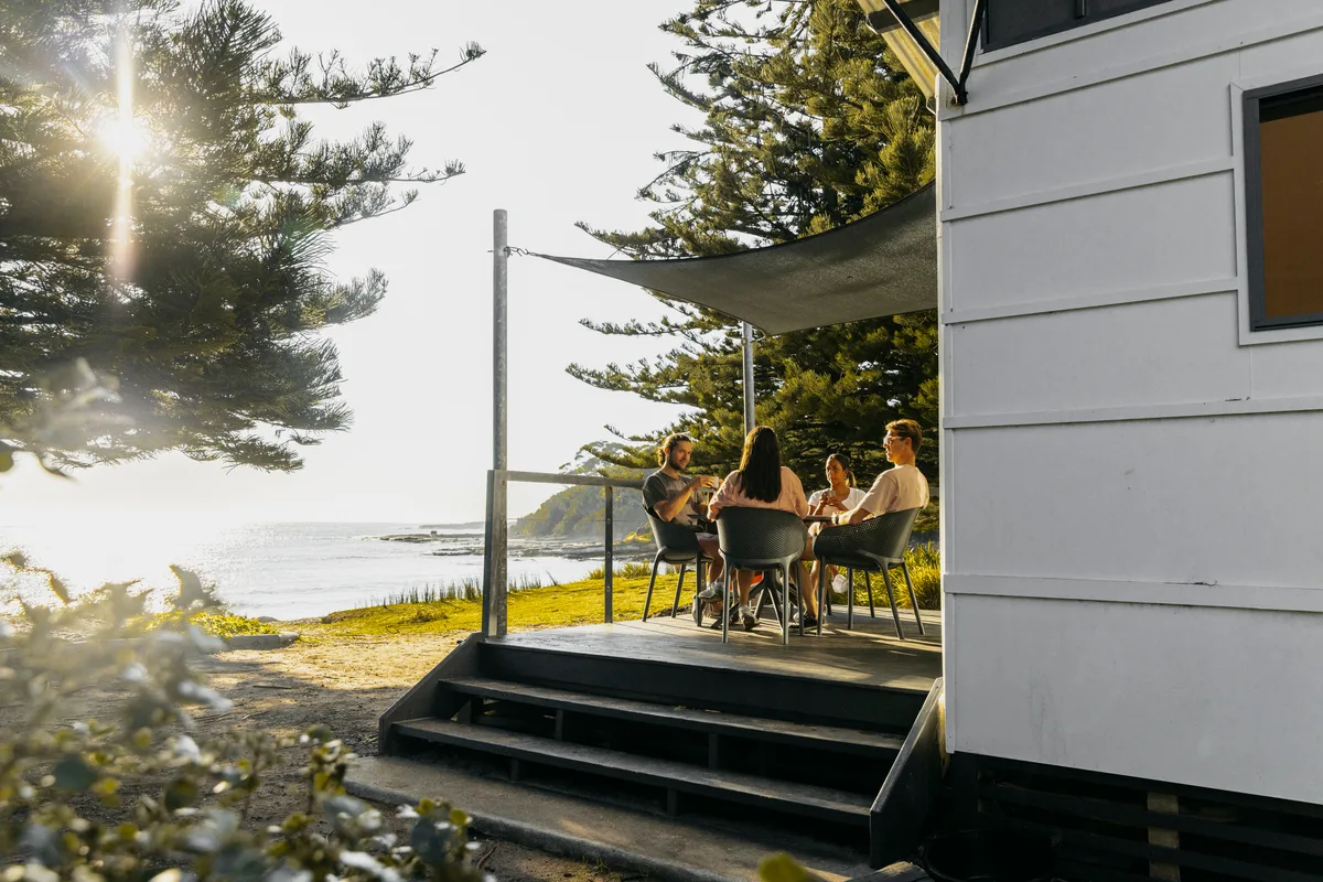 Family staying in a cabin at NRMA Parks and Resorts