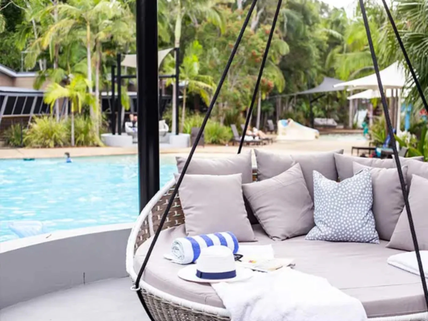 Swinging chair by the pool