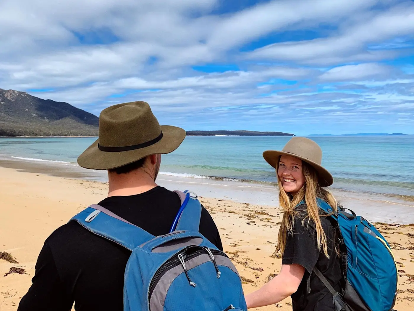 Couple on a walk at Great Oyster Bay near Freycinet Lodge