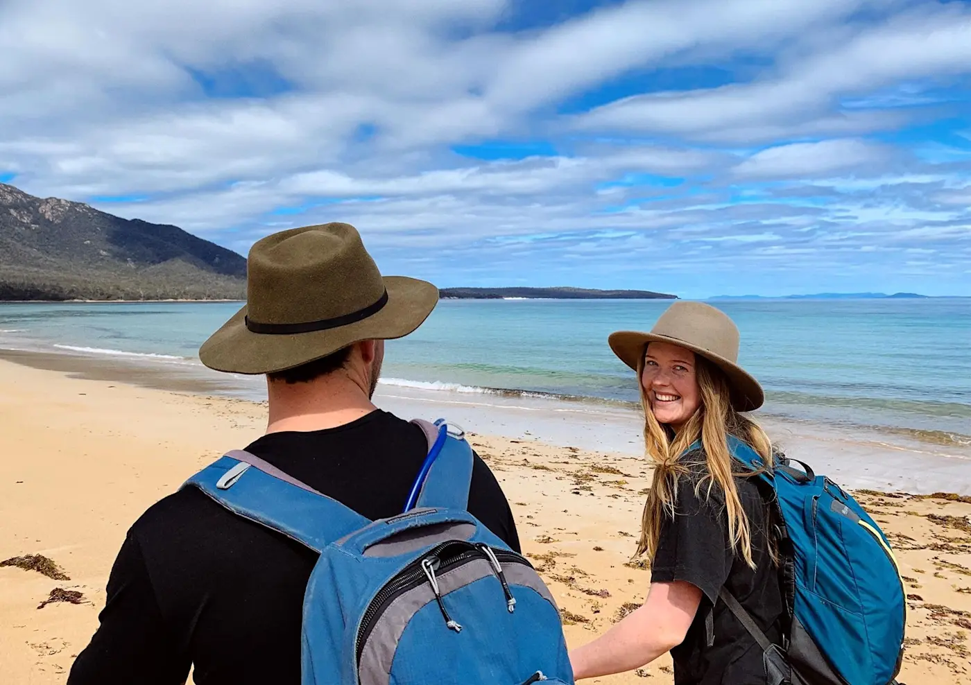 Couple on a walk at Great Oyster Bay near Freycinet Lodge