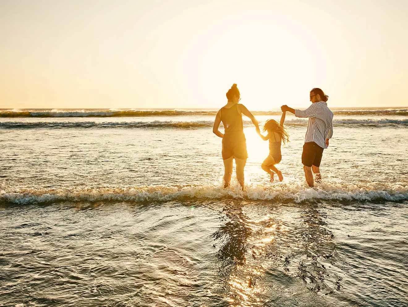 Family playing in the water at Turtle Sands