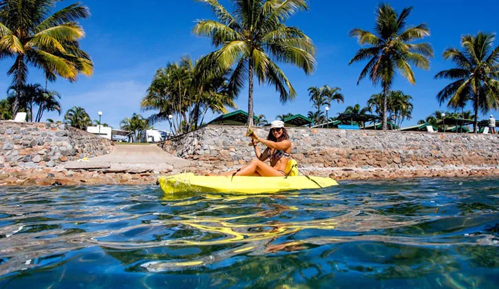 Woman canoeing off the waterfront