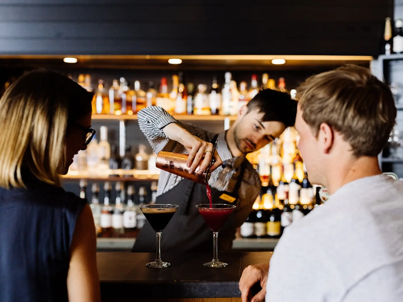 Bartender serving cocktails at Hazards Bar in Freycinet Lodge