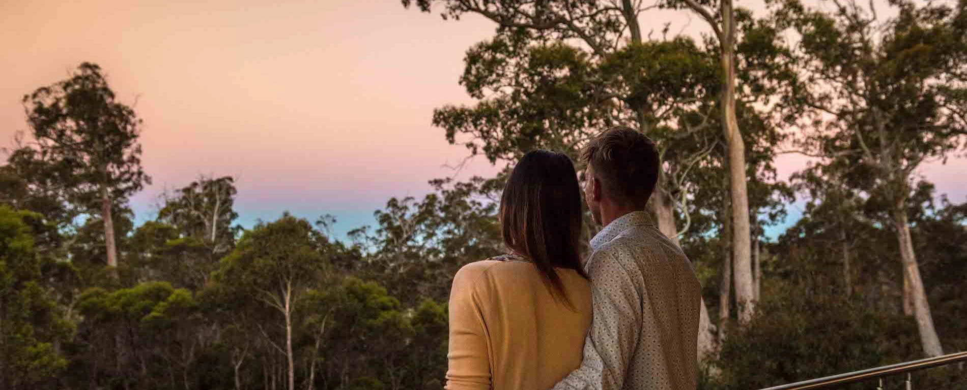 Couple enjoying the evening view from Cradle Mountain Hotel