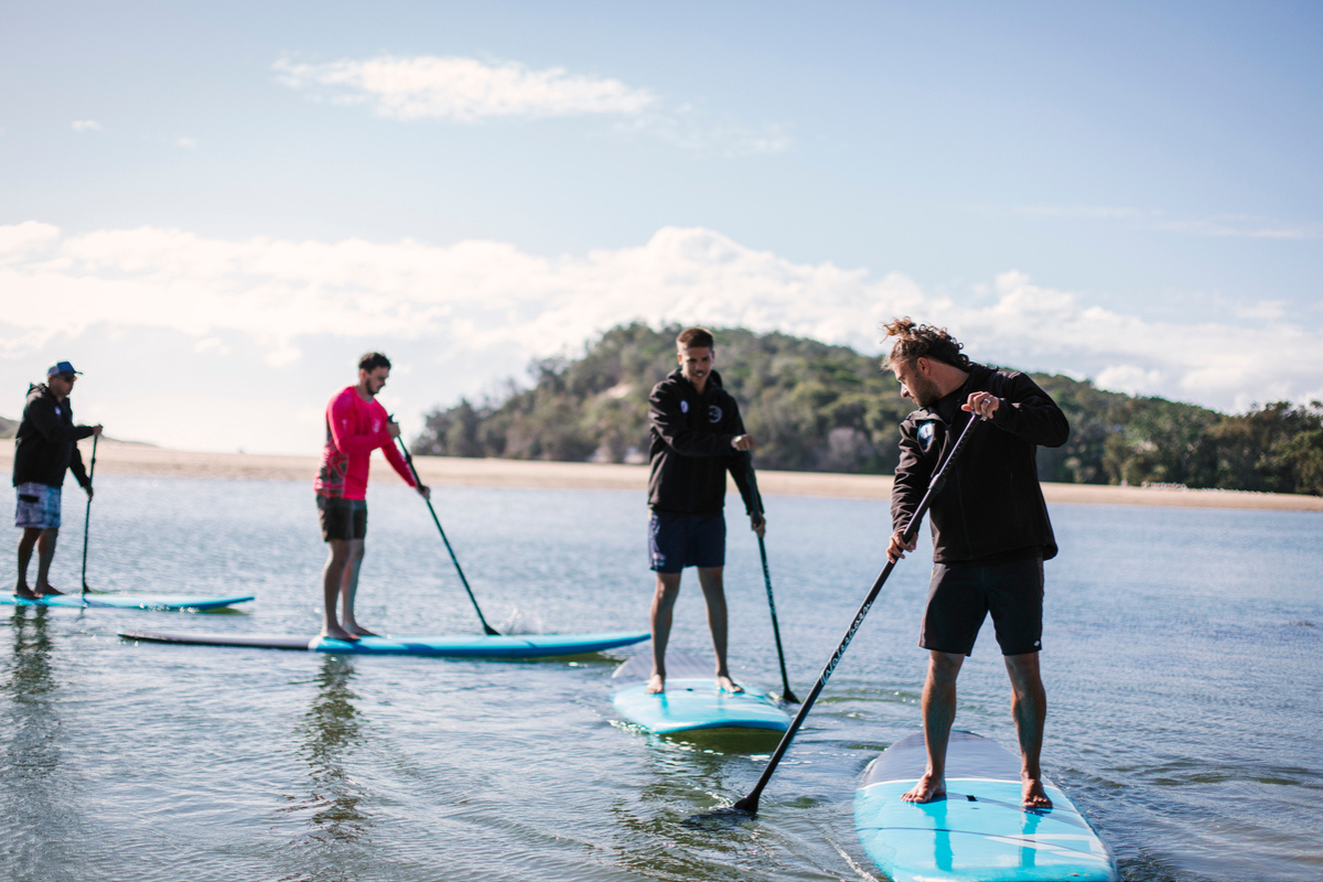Family paddle boarding caravan park near Red Rock