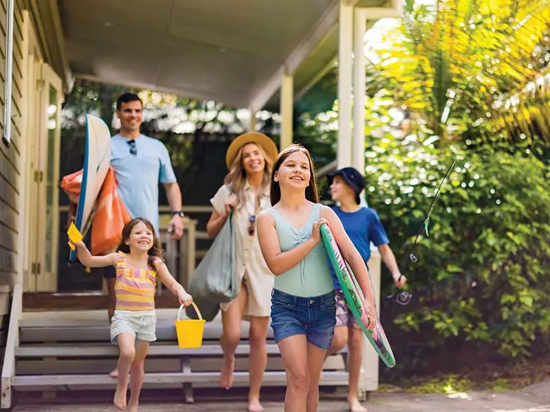 Family enjoying a cabin at NRMA Parks and Resorts