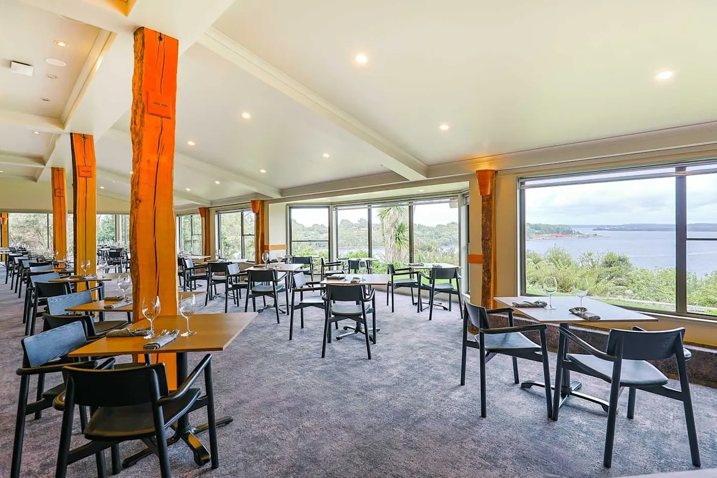 Tables arranged in View 42° Restaurant and Bar at Strahan Village