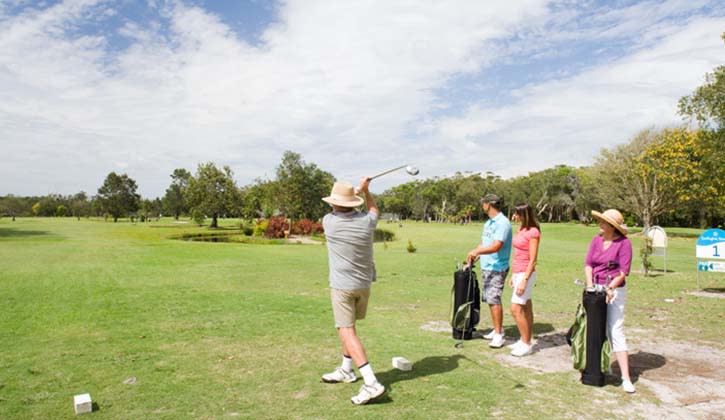 Visitors playing golf