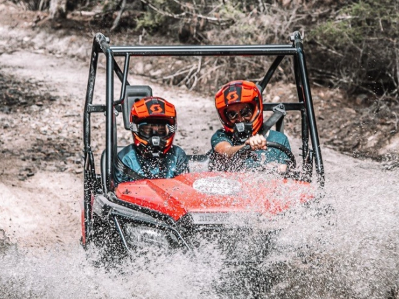 People on an ATV experience in a trail near Freycinet Lodge