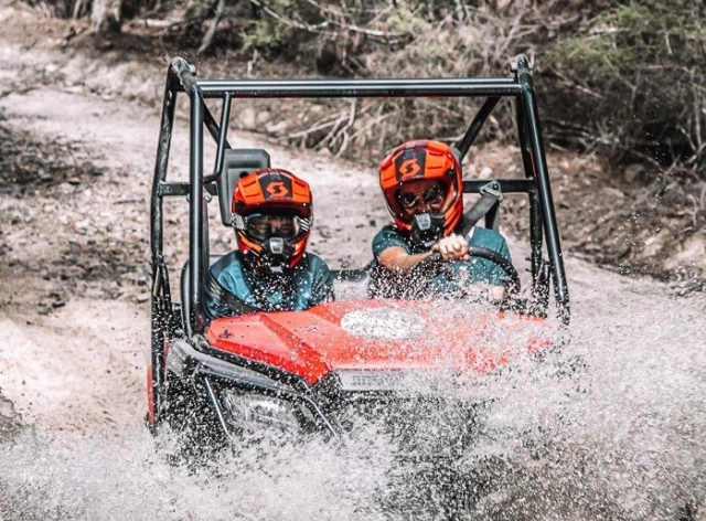 People on an ATV experience in a trail near Freycinet Lodge
