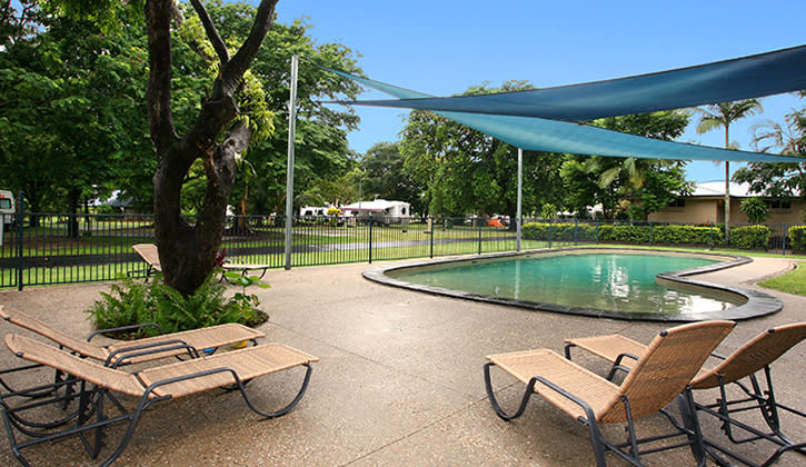 Cairns swimming pool with sun beds