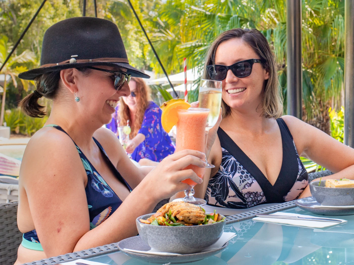 women having cocktails at Angourie Resort pool, Yamba