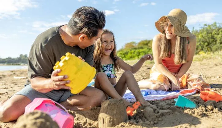 Beyond the tent family at beach 725x420 1