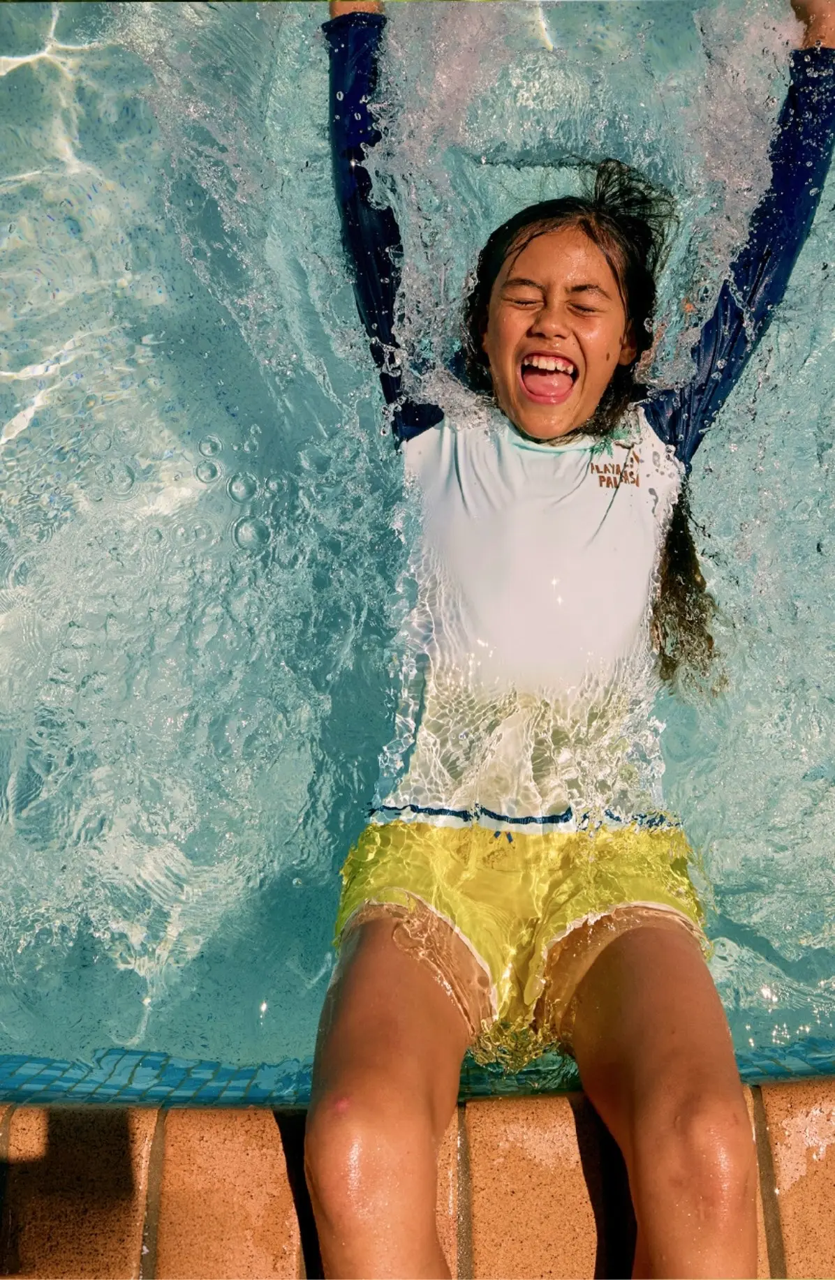 Kid swimming in the pool