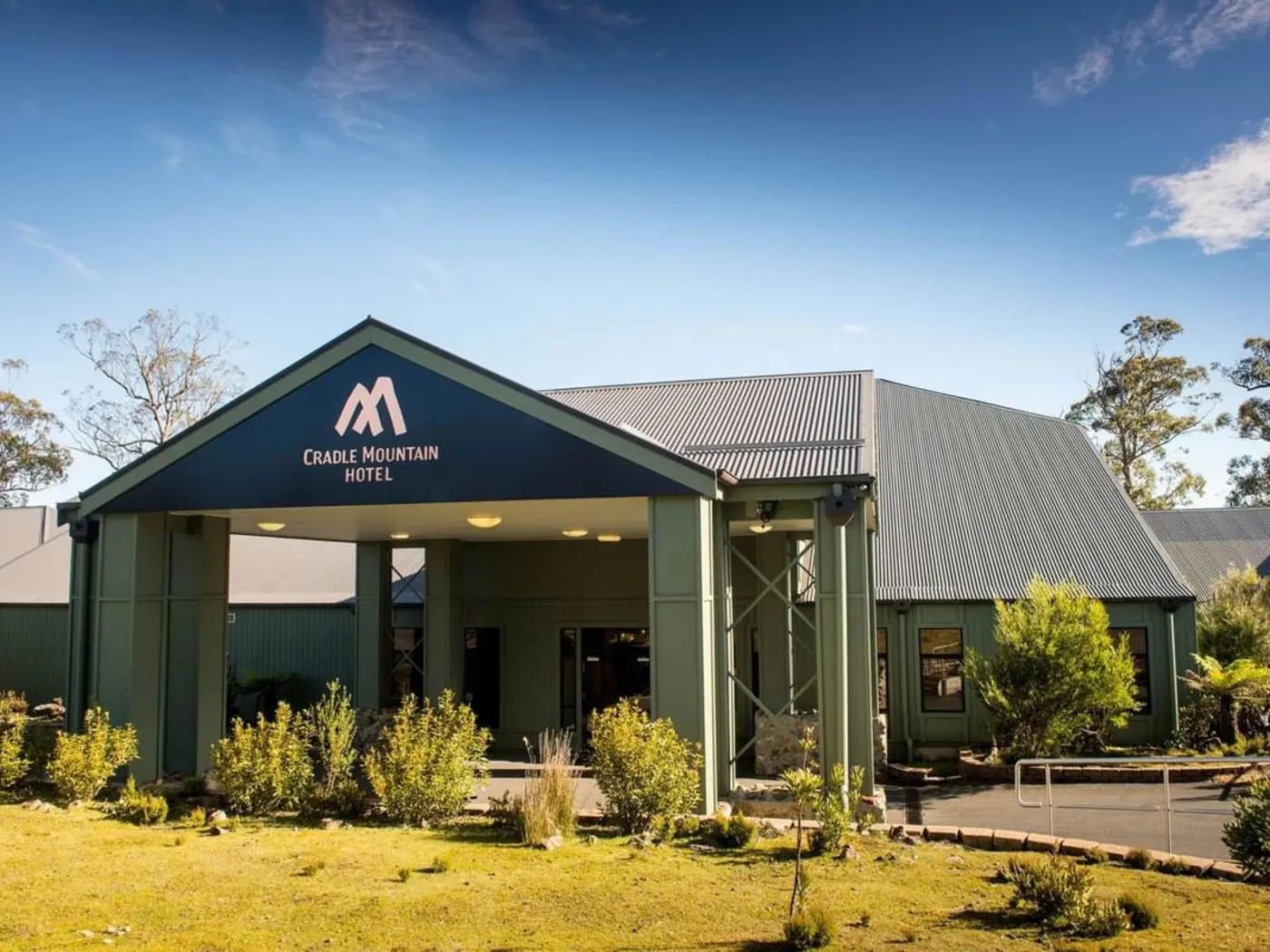 Exterior view with the garden at Cradle Mountain Hotel