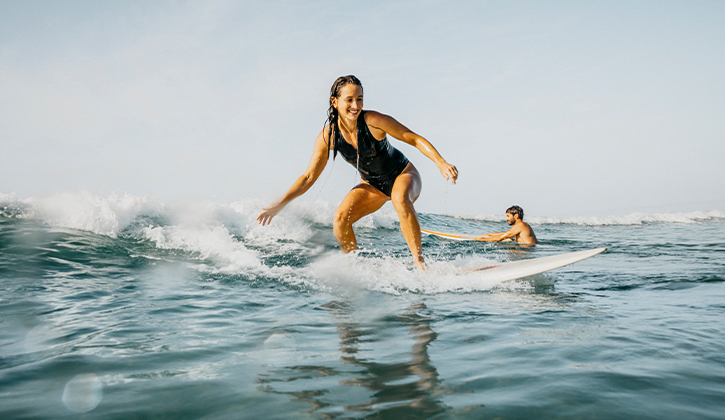 Woman surfing Forster